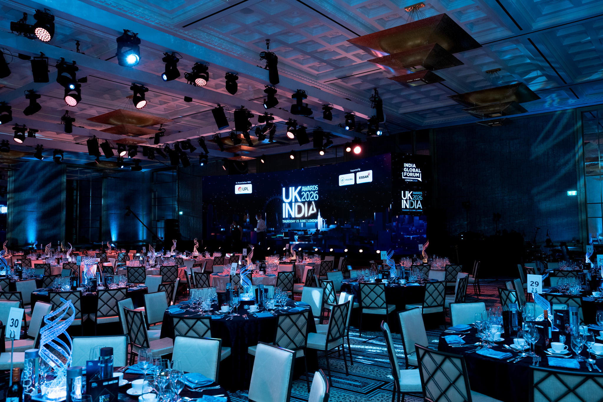 UK-India Awards 2026 at The Peninsula London — the ballroom under blue production lighting, by Kudos AV