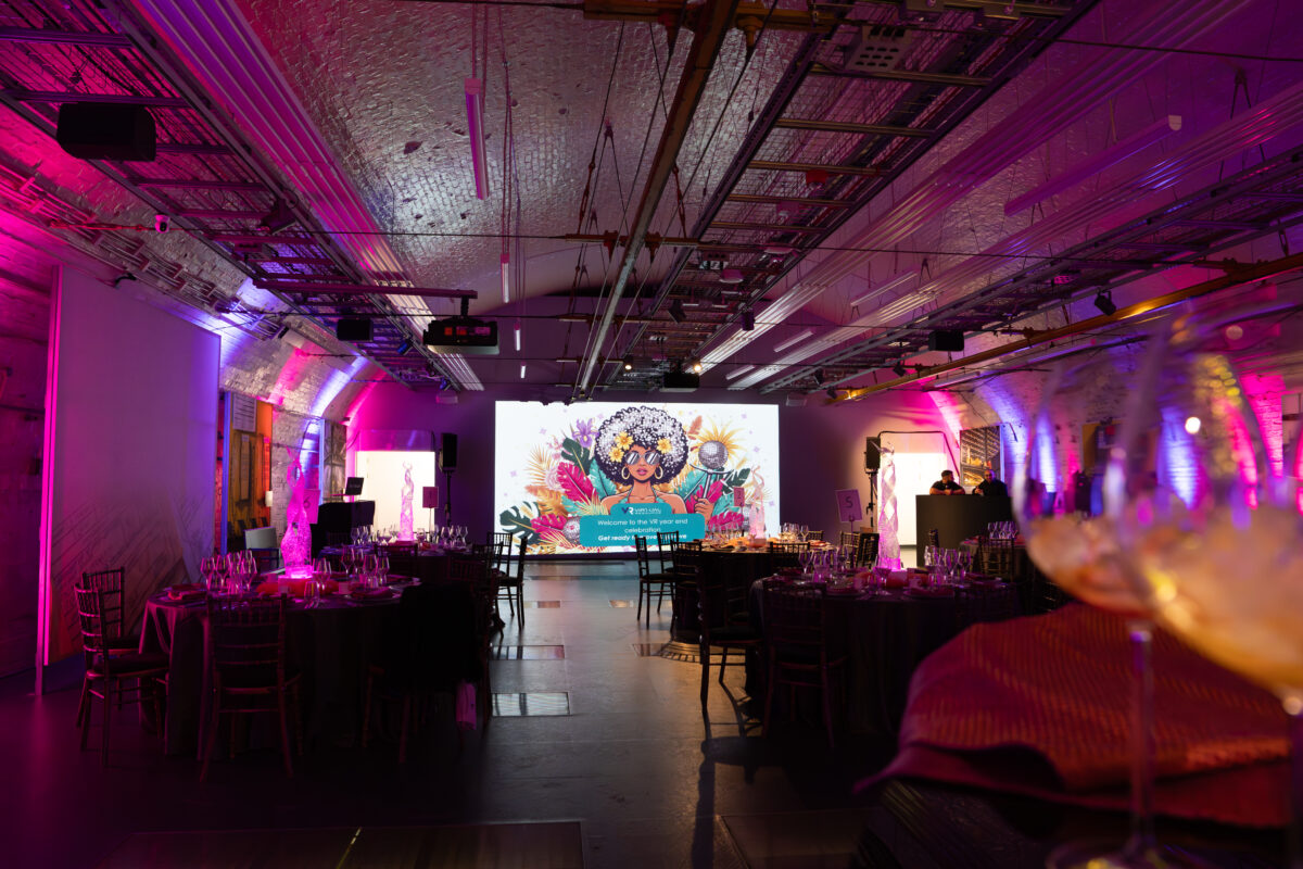 Foldster LED totem screens flanking a conference stage